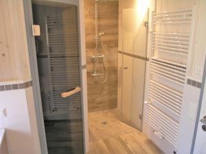 a bathroom with a shower with a glass door at Holiday Home Schwan by Interhome in Granzow
