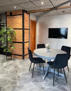 a meeting room with a table and chairs at BRIVIBAS RESIDENCE - STONES, free PRIVAT parking, free WIFI, self check-in in Rīga