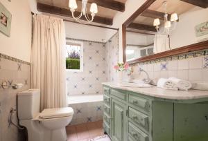 a bathroom with a sink and a toilet and a tub at Font in Mancor del Valle +20 photos