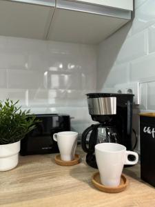 Příslušenství pro přípravu čaje a kávy v ubytování Apartamento 29