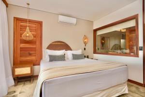 Postel nebo postele na pokoji v ubytování Carlore Hotel Taíba