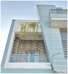 an external view of a building with windows at 3 BR Luxe Penthouse nearby Harkipauri by Manstays in Haridwār