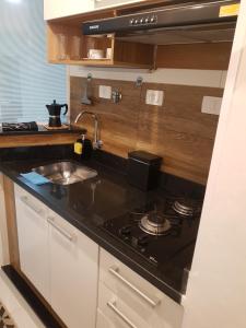 Η κουζίνα ή μικρή κουζίνα στο Studio 215 Campinas SP