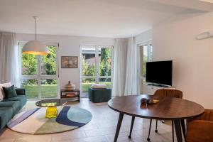 a living room with a couch and a table at Ferienwohnung Tödiblick in Wangen im Allgäu