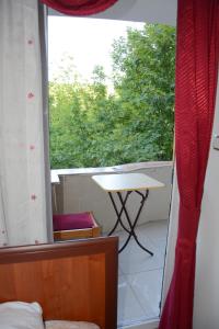 a view of a balcony with a table and a window at GOLD OTEL KASTAMONU in Kastamonu
