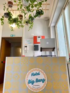 a table with a sign that reads hotel fly sung at Hotel Big Bang in Rome