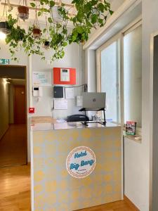 an office with a counter with a laptop on it at Hotel Big Bang in Rome