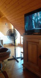 A television and/or entertainment centre at Komfort Apartman