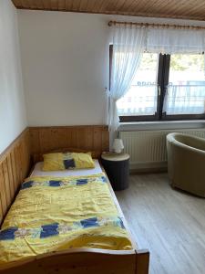 Postel nebo postele na pokoji v ubytování Pension am Eichenhain