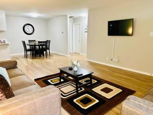 A seating area at Charming Retreat in Oak Park, IL Modern Comforts