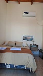 a bedroom with a bed in a room at Rincón con Encanto in Salta
