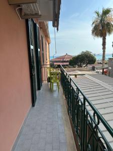 a balcony of a building with a table and chairs at CASA ANGELA Vista mare in Ventimiglia