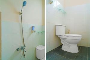 a bathroom with a toilet and a shower at OYO Life 92720 Mekarwangi Guest House in Bandung