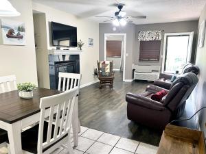 a living room with a couch and a table at The River Cottage in Pigeon Forge