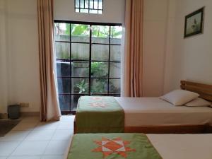 Ένα ή περισσότερα κρεβάτια σε δωμάτιο στο Hotel Apna Galle