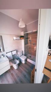 a bathroom with two toilets and a shower at Dimora sicula guest house in Catania