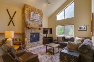 a living room with a couch and a fireplace at 8 Mi to Copper Mountain Frisco Vacation Rental in Frisco