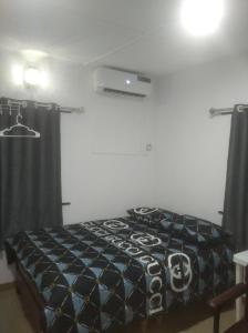 a bedroom with a bed in a room at Chinaka guest house in Lagos