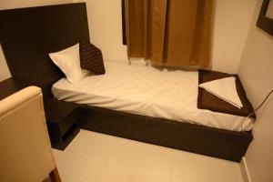 Hotel Tripti-Biswanath Chariali客房内的一张或多张床位