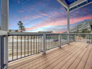 a deck with a view of the beach at Tiny Timber Tree Home NEW in Flagstaff