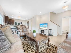 a living room with a coffee table and a kitchen at Tiny Timber Tree Home NEW in Flagstaff