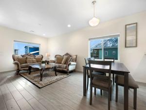 a living room with a table and a dining room at Tiny Timber Tree Home NEW in Flagstaff