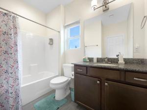 a bathroom with a toilet and a sink and a shower at Tiny Timber Tree Home NEW in Flagstaff +26 photos