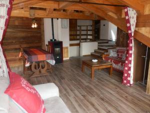 a living room with a couch and a stove at Ampia mansarda con vista panoramica in La Salle