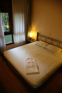 Giường trong phòng chung tại Mui Ne Resort