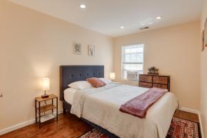 a bedroom with a large bed and a window at Washington DC Home about 5 Mi to National Mall! in Washington, D.C.