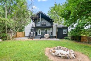 a house with a balcony and a house at Madison Terrace - Large Home With Game Room - 10 in Clarksville