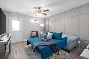 a bedroom with a blue bed with a teddy bear on it at Modern 3-bedroom Close To Ft, Campbell in Clarksville