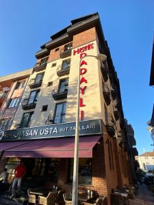 a building with a hotel sign on the side of it at AMASRA DADAYLI HOTEL in Amasra