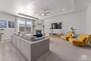 a living room with a couch and two chairs at Sienna Sunrise home in Washington
