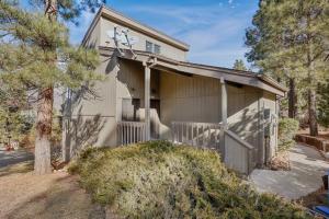 a house with a clock on the side of it at Brand New Listing Country Club Condo in Flagstaff