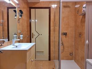 a bathroom with a shower and a sink at Maria's - Parking Area, no ZTL, close Train Station and Beach in Cefalù