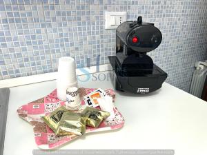 a coffee maker sitting on top of a counter at Sofia's Home 2 in Terracina