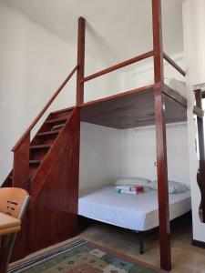 a bunk bed in a room with a staircase at Alba Private Room in Milan