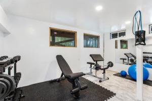 a gym with treadmills and exercise equipment at Fire Island Pines Rooms in Fire Island Pines