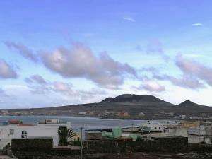 a view of a city and a body of water at Beach Villa with pool in Mindelo