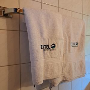 a towel hanging on a towel rack in a bathroom at Wohn-Eitel Romantik in Bad Wildbad