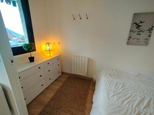 a bedroom with a white bed and a window at Appartement Avoriaz, 2 pièces, 4 personnes - FR-1-633-73 in Morzine