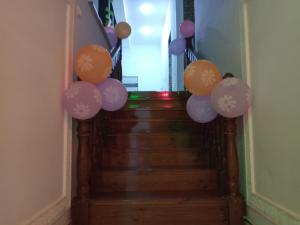 a bunch of balloons on a stairway at Boutique Hotel Parvina in Bukhara