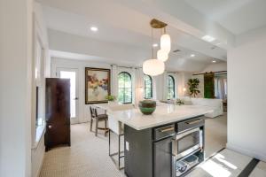 a kitchen and living room with a large island at Striking Getaway in Desirable Tampa District! in Tampa