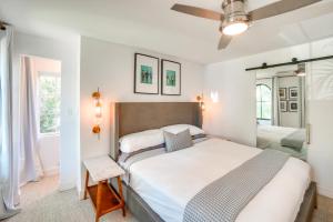 a bedroom with a large bed and a mirror at Striking Getaway in Desirable Tampa District! in Tampa