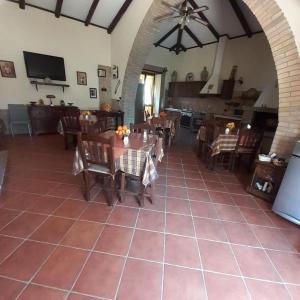 a dining room with tables and chairs in a room at B&B Villa Rosalia in Barrafranca
