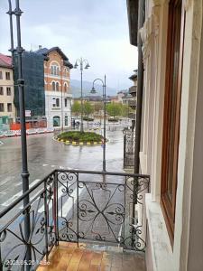 a balcony with a view of a city street at Alloggio Asiago Centro (appartamento nuovo) in Asiago