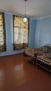 a bedroom with two bunk beds and a window at Guest house 