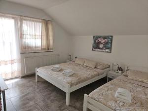 Ein Bett oder Betten in einem Zimmer der Unterkunft Rooms Sapina