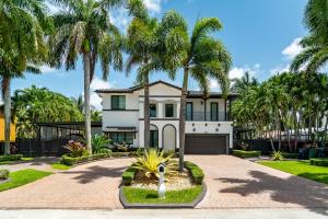 a house with palm trees in front of it at The tropical paradise villa in Miami